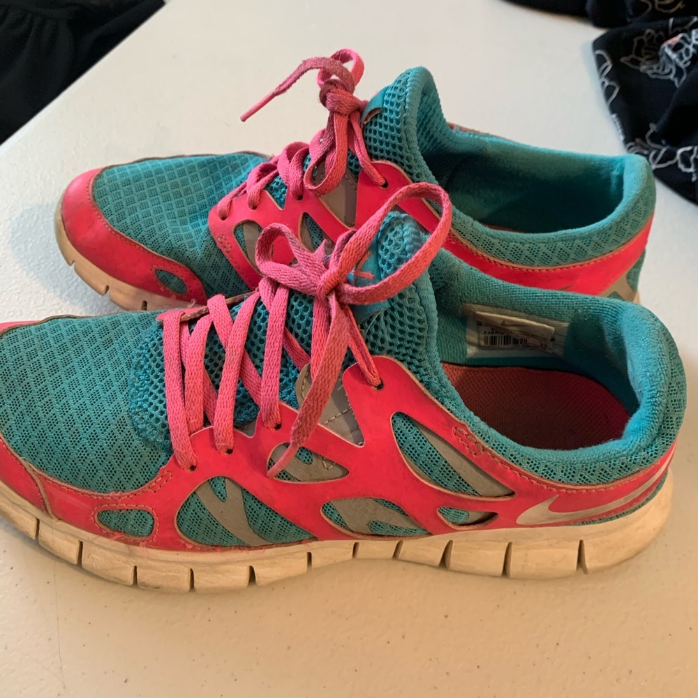 Blue/pink NIKE running shoes